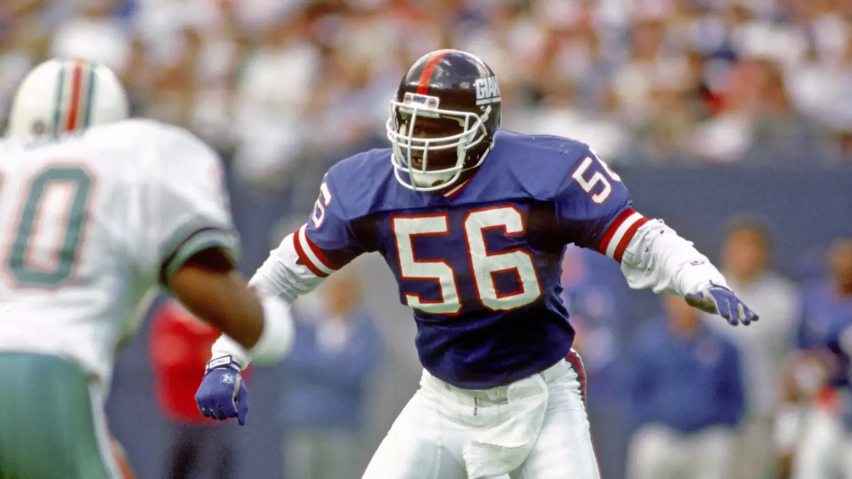 Lawrence Taylor, left, of the Super Bowl Champion New York Giants