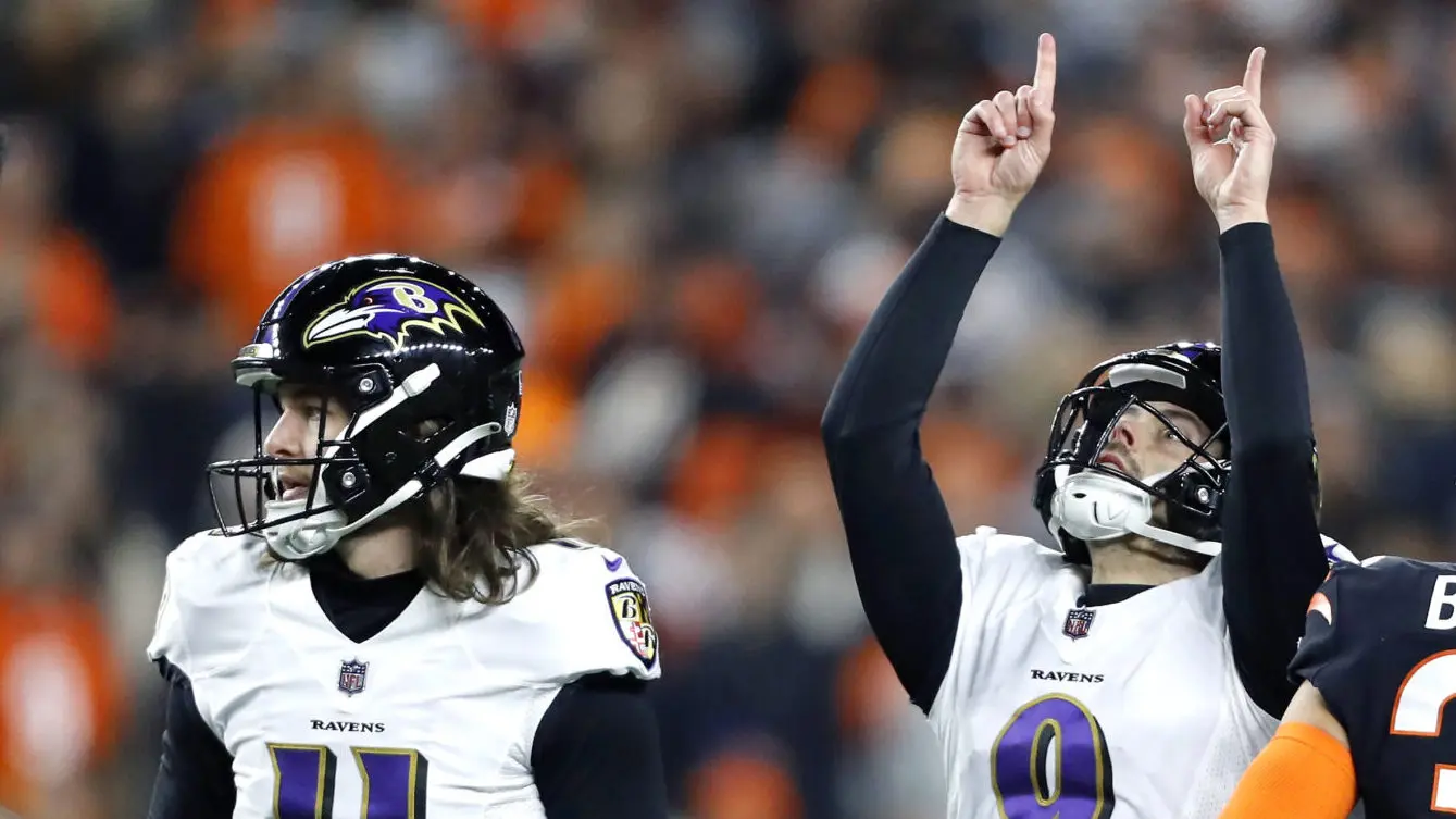 Baltimore Ravens kicker Justin Tucker (9), with Jordan Stout