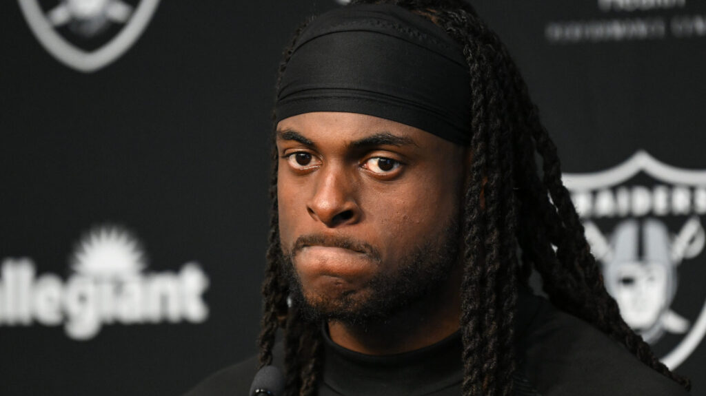 Raiders WR Davante Adams sits during a press conference