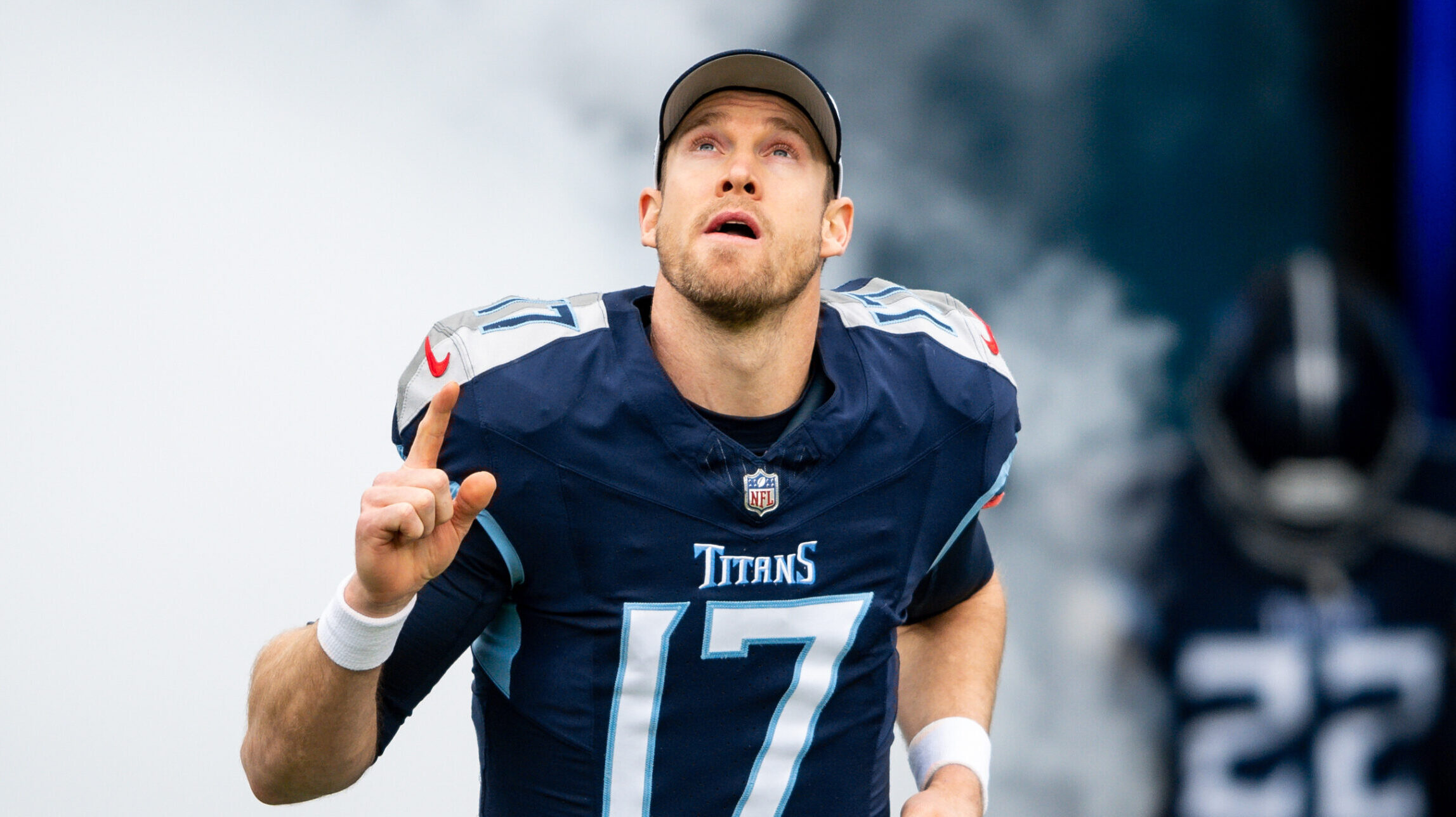 Ryan Tannehill points up while running out of the Titans tunnel