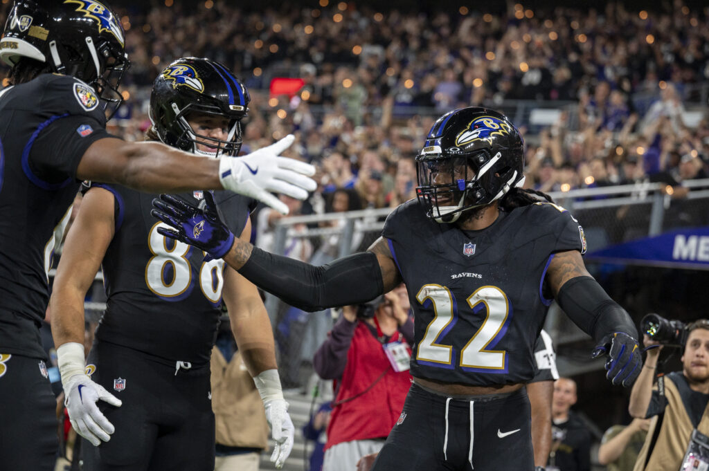 Baltimore Ravens running back Derrick Henry (22) celebrates with teammates after scoring during the second quarter against the Buffalo Bills at M&T Bank Stadium. 