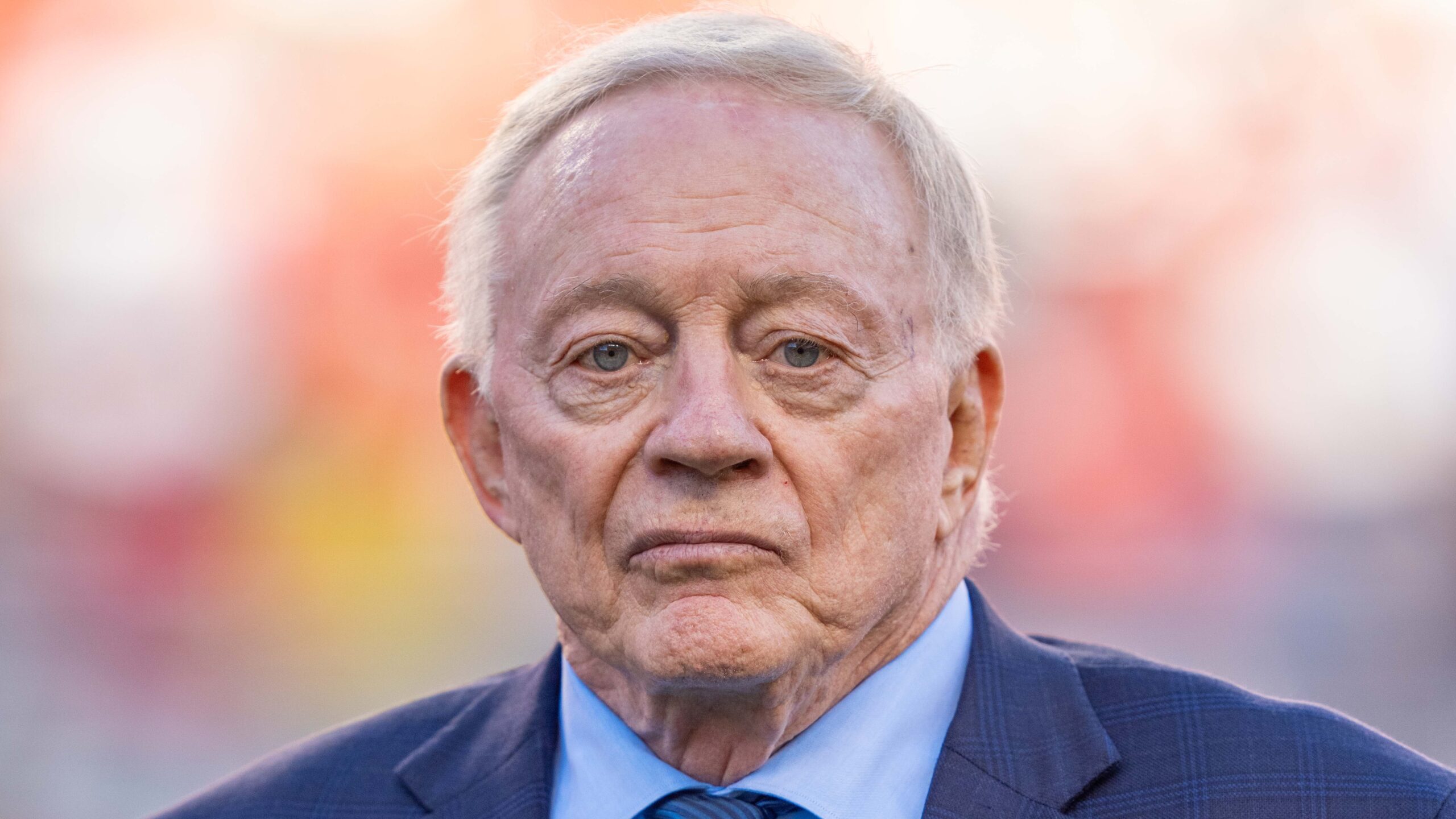 Jerry Jones stares into the camera with a disappointed face.