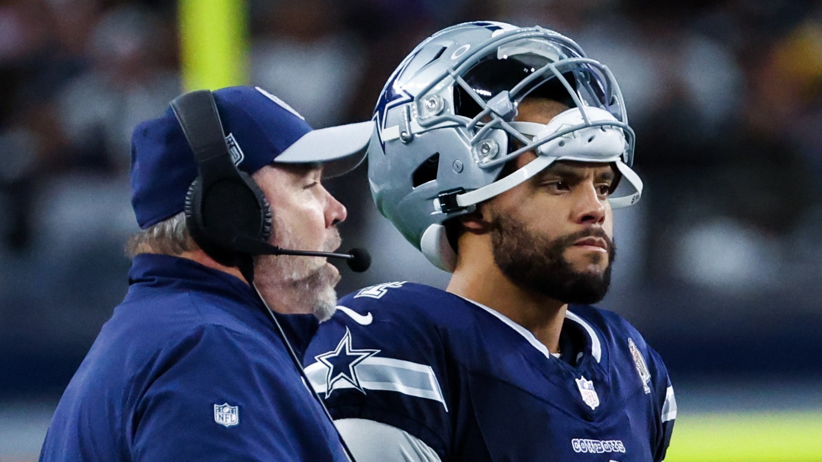 Mike McCarthy stands with Dak Prescott