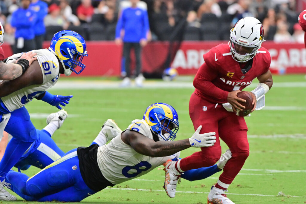 Arizona Cardinals quarterback Kyler Murray escaping a tackle by Los Angeles Rams linebacker Jared Verse during a game at State Farm Stadium in Glendale, Arizona on September 15, 2024