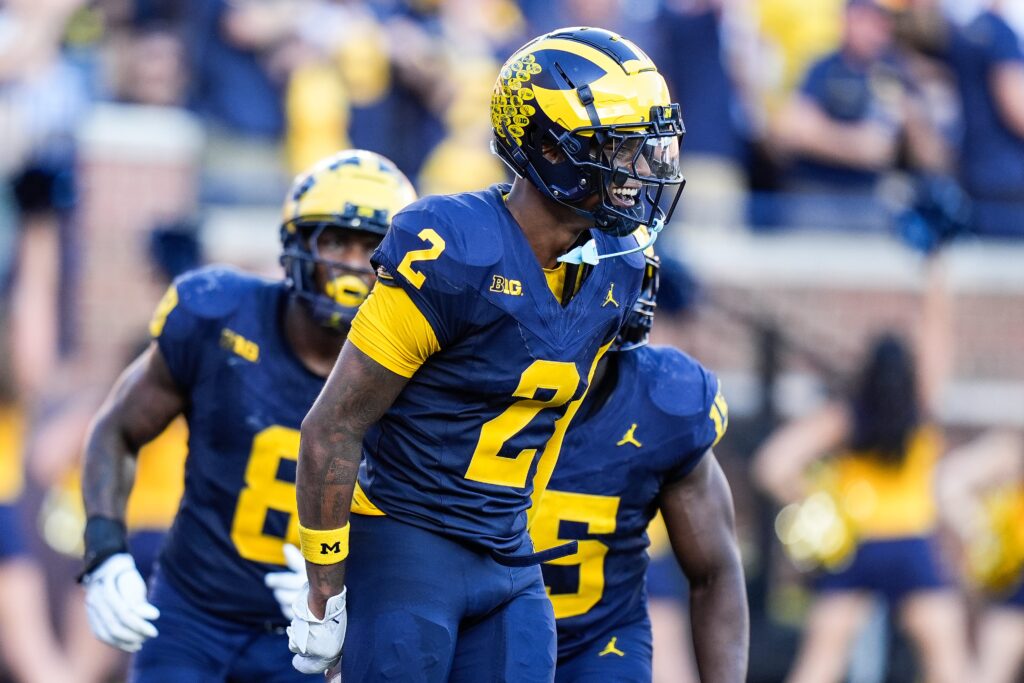 Michigan defensive back Will Johnson celebrates a touchdown after intercepting USC quarterback Miller Moss during the second half at Michigan Stadium in Ann Arbor