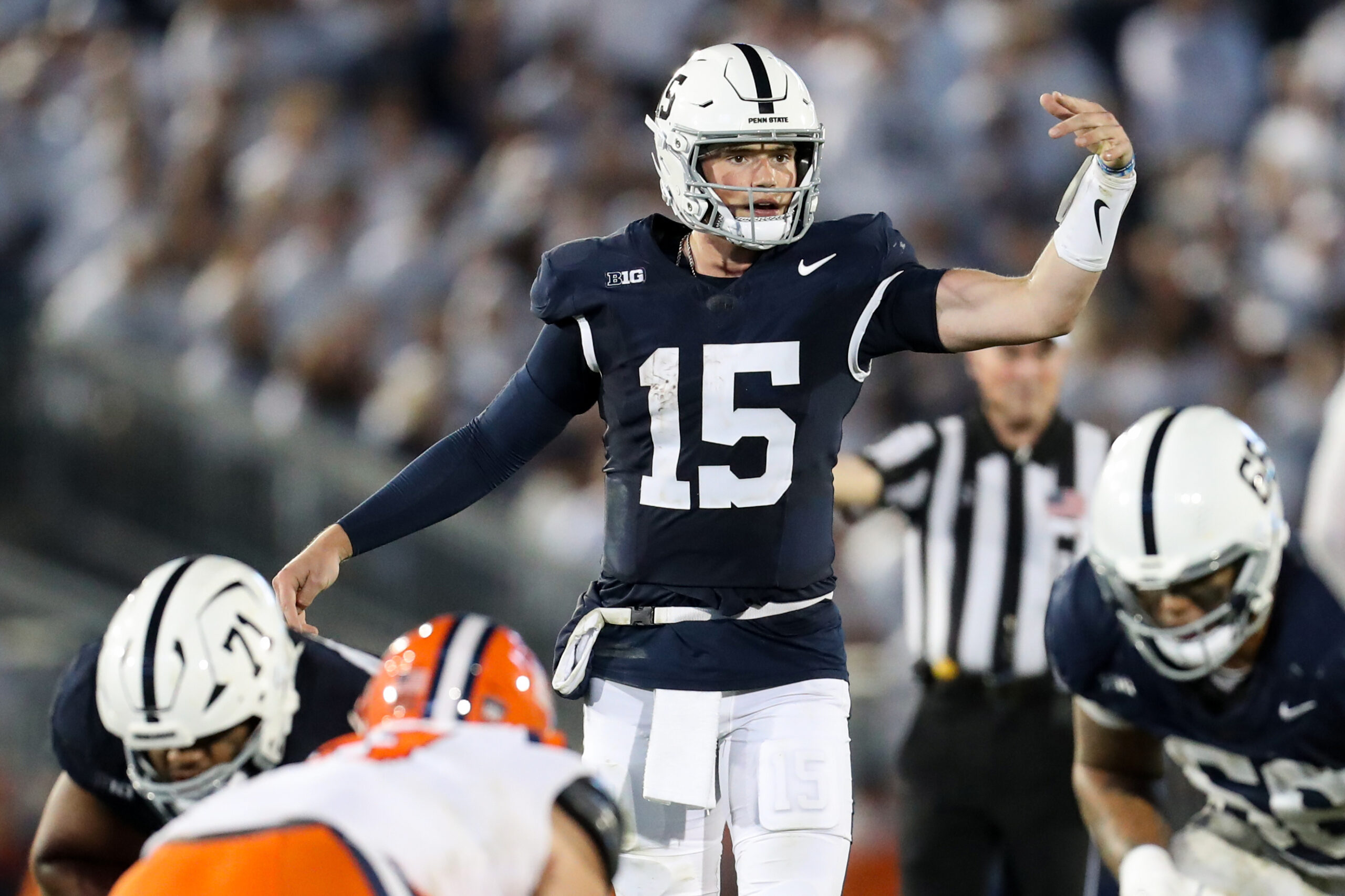 Penn State Nittany Lions quarterback Drew Allar (15) signals during the fourth quarter against the Illinois Fighting Illini at Beaver Stadium.