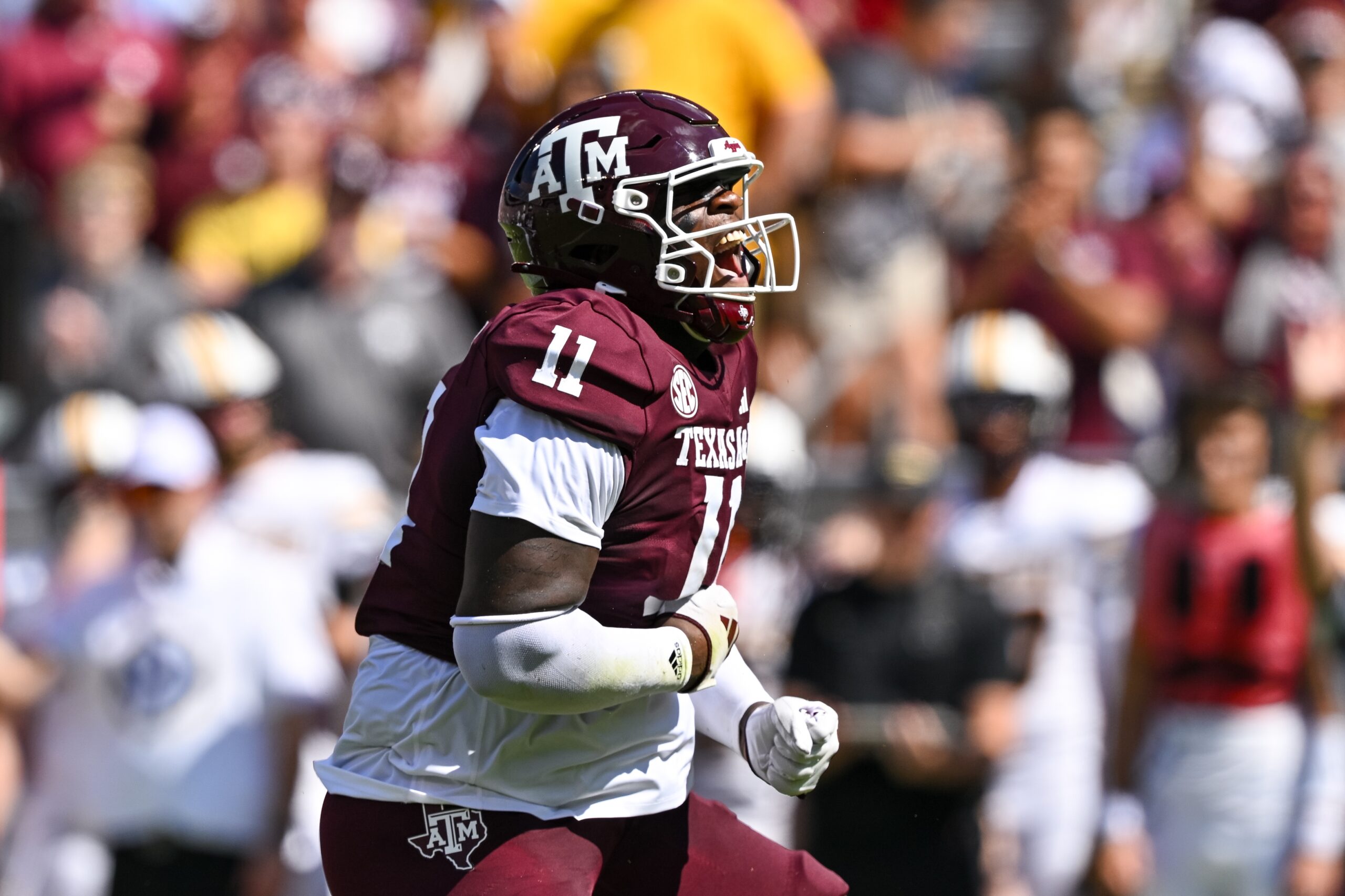 Aggies defensive lineman Nic Scourton (11) reacts after sacking Missouri Tigers quarterback Brady Cook in the first quarter at Kyle Field.