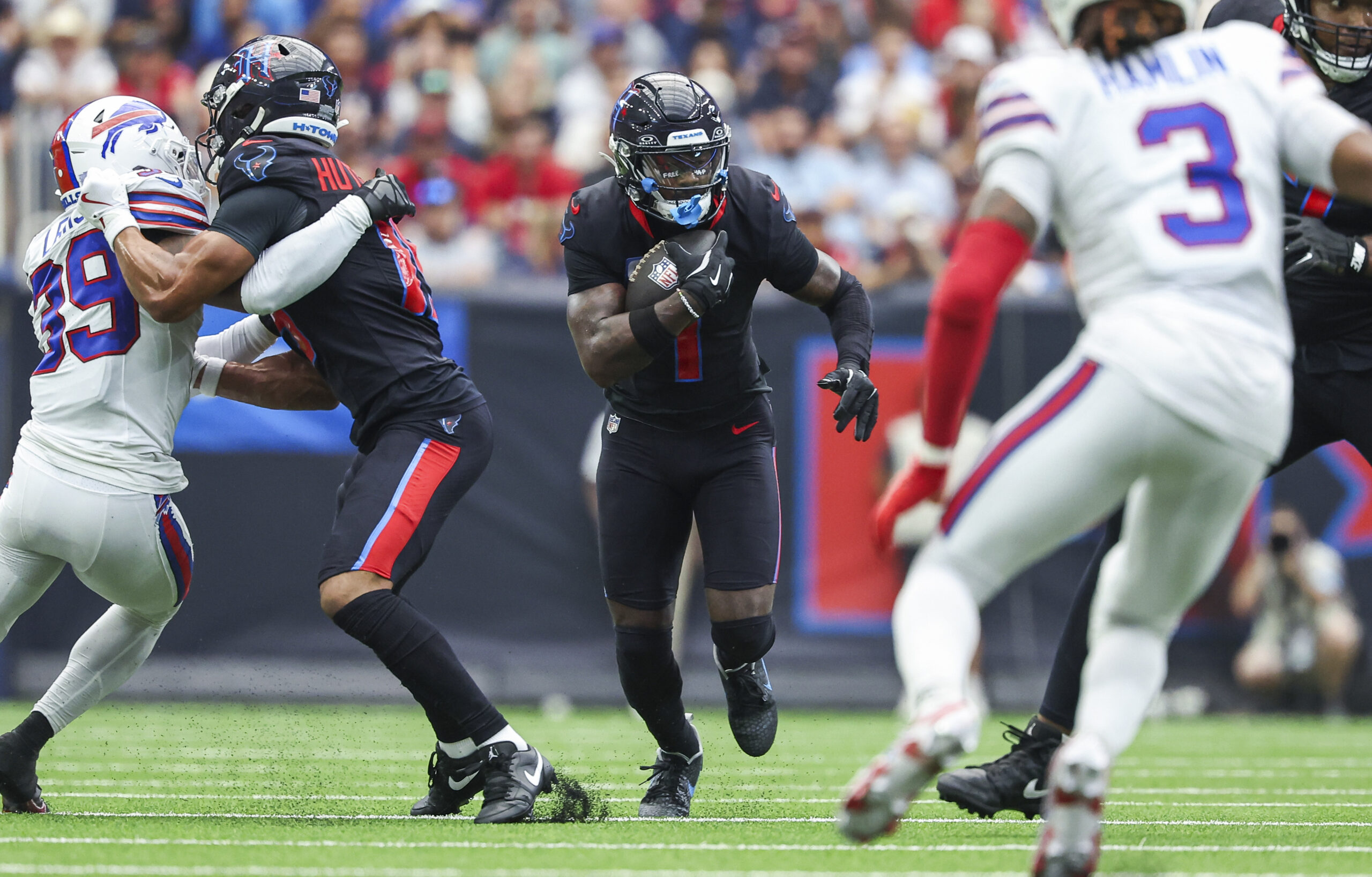 Houston Texans wide receiver Stefon Diggs (1) runs with the ball after a reception during the second quarter against the Buffalo Bills at NRG Stadium.