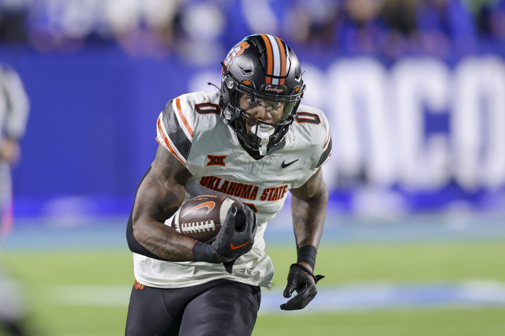 Oklahoma State Cowboys running back Ollie Gordon II runs for a catch for a touchdown against the Brigham Young Cougars during the first quarter at LaVell Edwards Stadium.