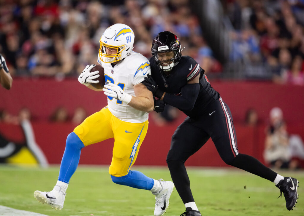 Los Angeles Chargers tight end Will Dissly is pushed out of bounds by Arizona Cardinals linebacker Julian Okwara at State Farm Stadium. 