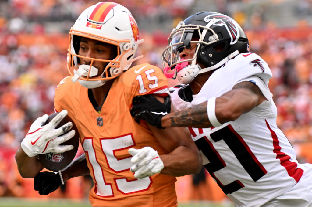 Tampa Bay Buccaneers wide receiver Jalen McMillan gets tackled by Atlanta Falcons defensive back Mike Hughes in the second half at Raymond James Stadium. 