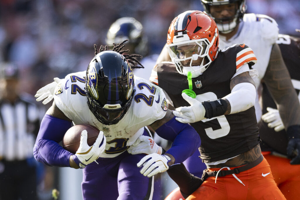 Baltimore Ravens running back Derrick Henry running the ball as Cleveland Browns safety Grant Delpit tackles him during the fourth quarter at Huntington Bank Field in Cleveland, Ohio on October 27, 2024