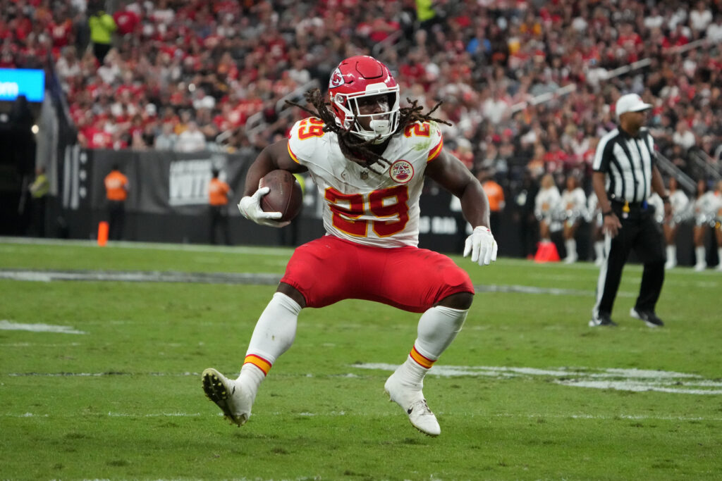 Kansas City Chiefs running back Kareem Hunt carries the ball against the Las Vegas Raiders in the first half at Allegiant Stadium.