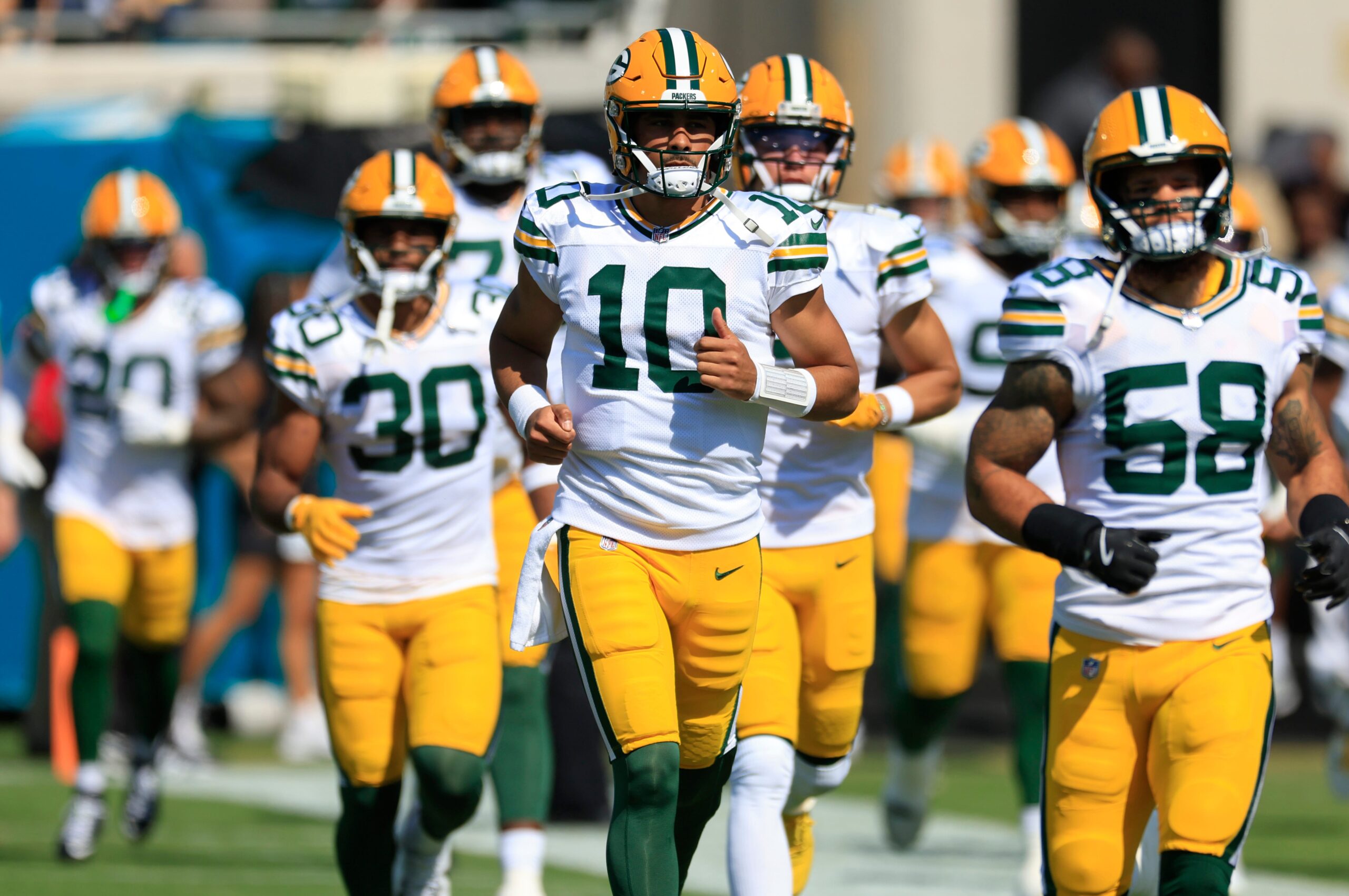 Green Bay Packers quarterback Jordan Love runs on the field with the team before an NFL football matchup Sunday, Oct. 27, 2024 at EverBank Stadium in Jacksonville, Fla.