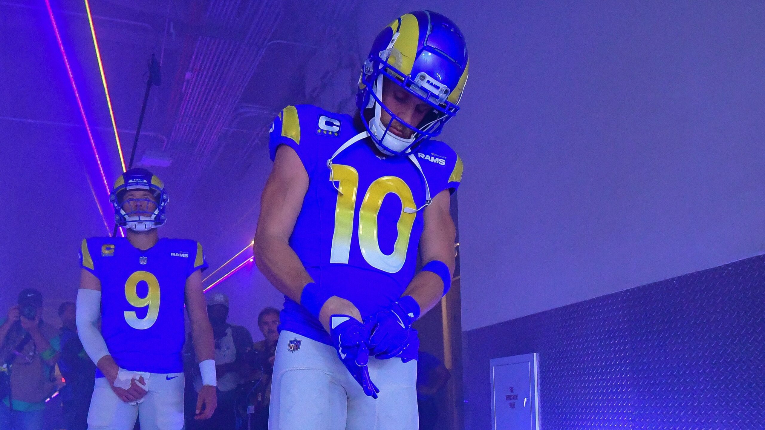 Cooper Kupp straps up his gloves while in the tunnel