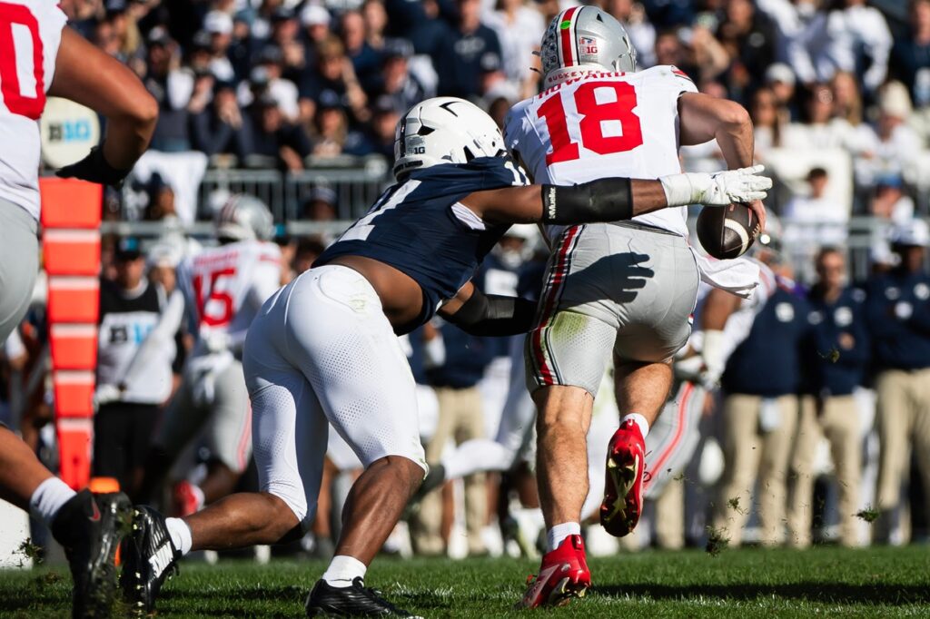 Penn State's Abdul Carter sacks Ohio State quarterback Will Howard during a college football game