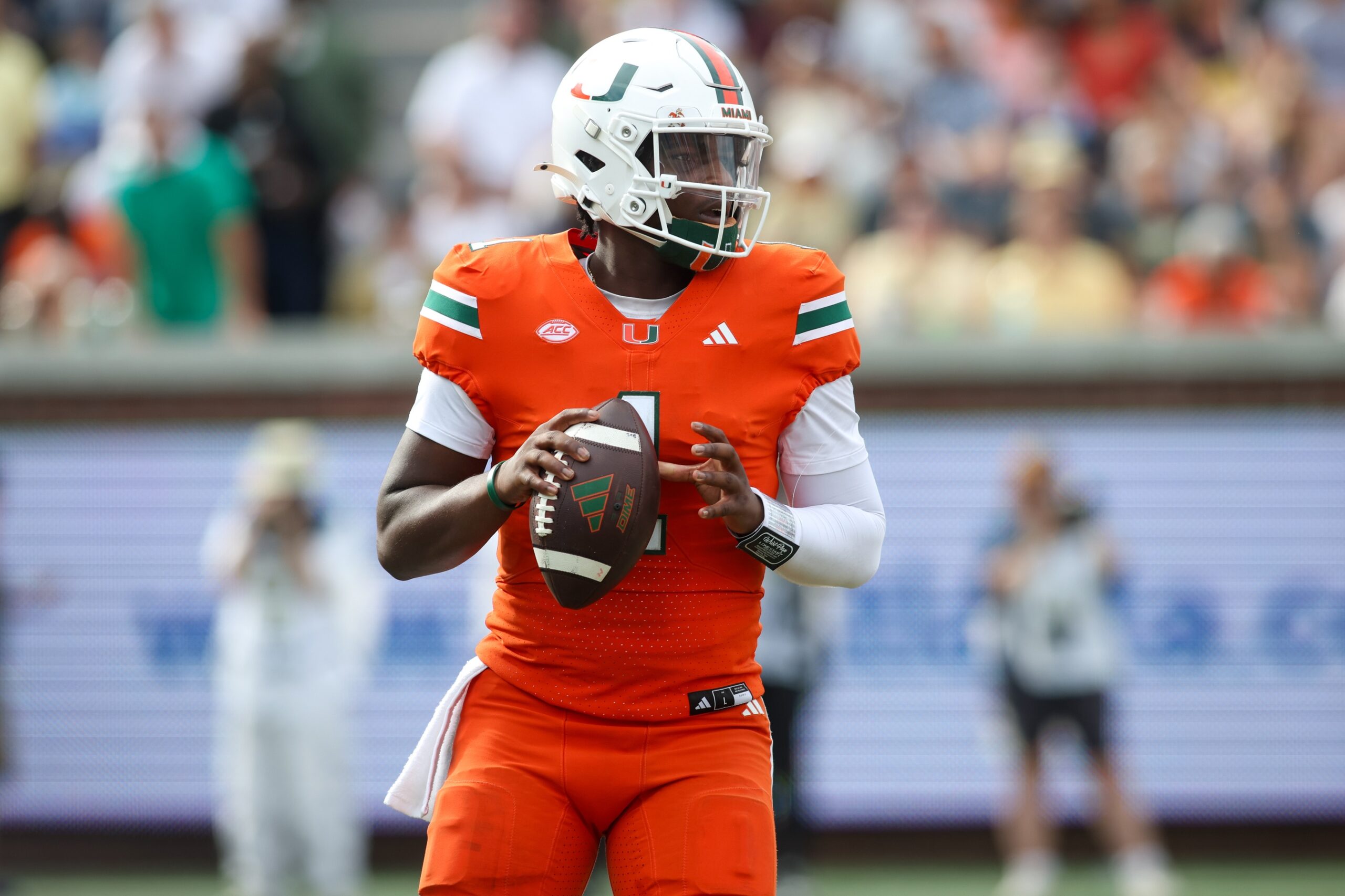 Miami Hurricanes quarterback Cam Ward drops back to pass against Georgia Tech Yellow Jackets in college football game action at Bobby Dodd Stadium