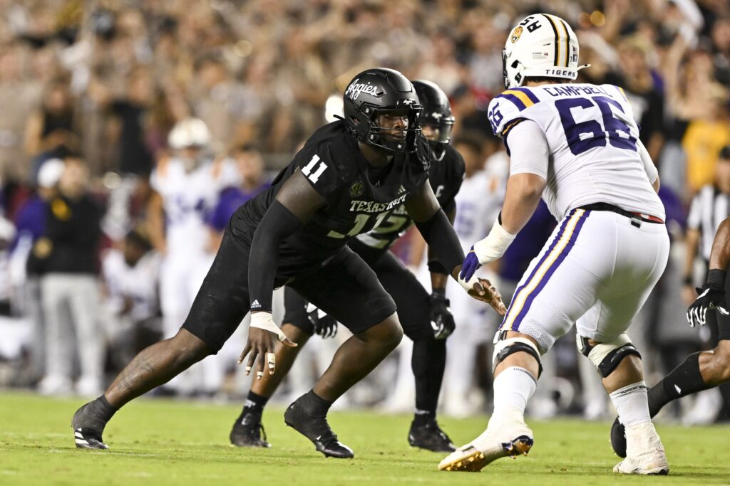 Texas A&M Aggies defensive lineman Nic Scourton defends in coverage against LSU Tigers offensive tackle Will Campbell during college football game action at Kyle Field