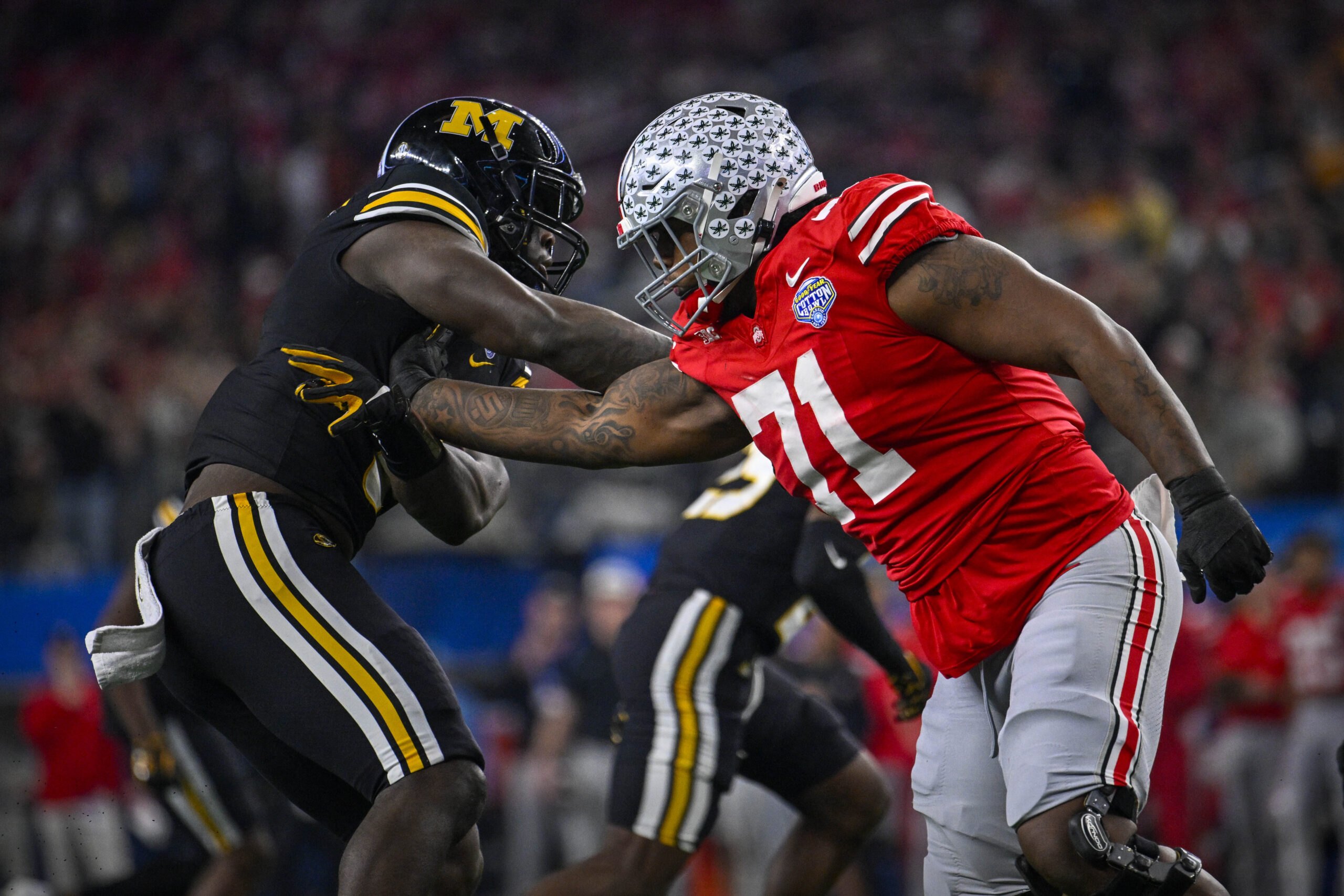 Ohio State Buckeyes offensive lineman Josh Simmons (71) blocks Missouri Tigers defensive lineman Darius Robinson (6) during the second quarter at AT&T Stadium.