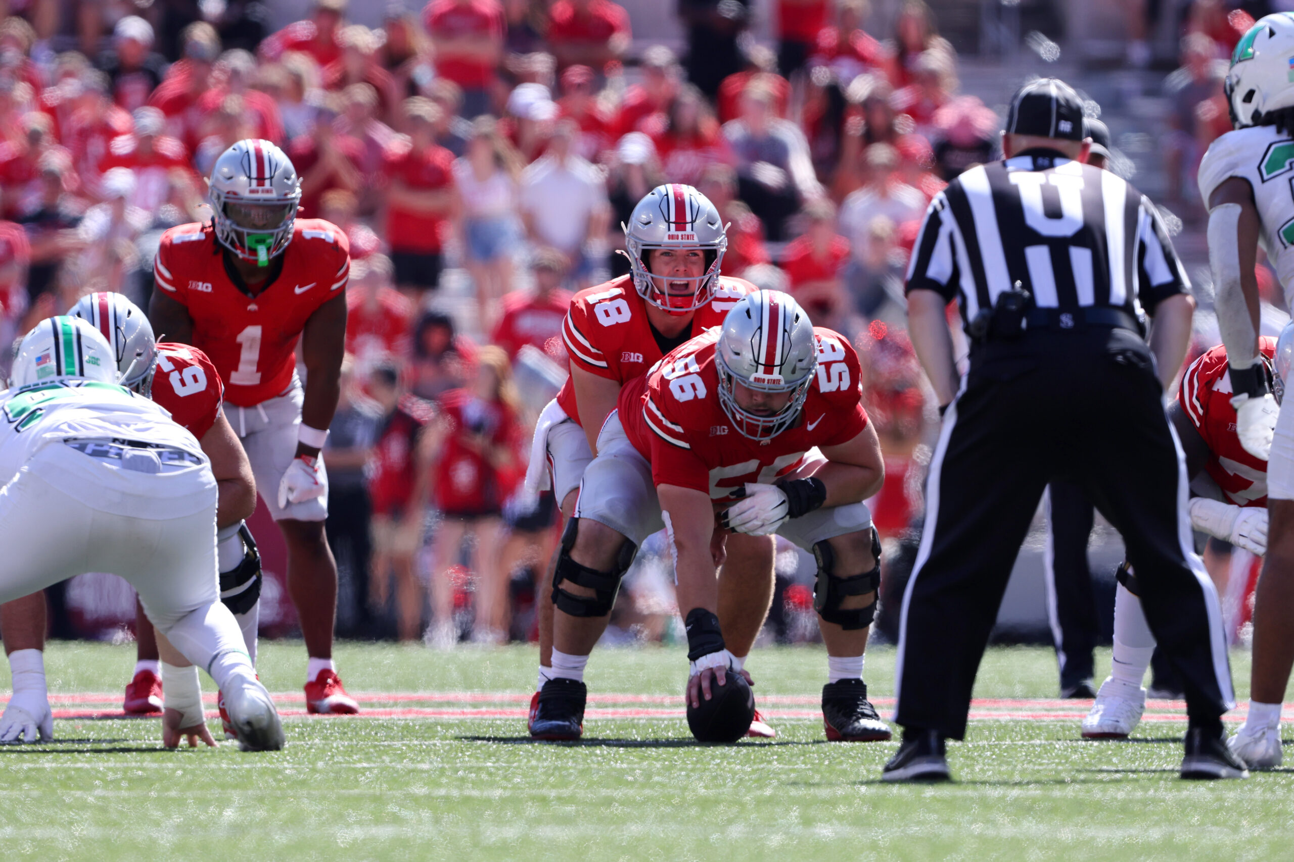 Ohio State Buckeyes quarterback Will Howard lines up under Ohio State Buckeyes offensive lineman Seth McLaughlin during the third quarter against the Marshall Thundering Herd at Ohio Stadium.