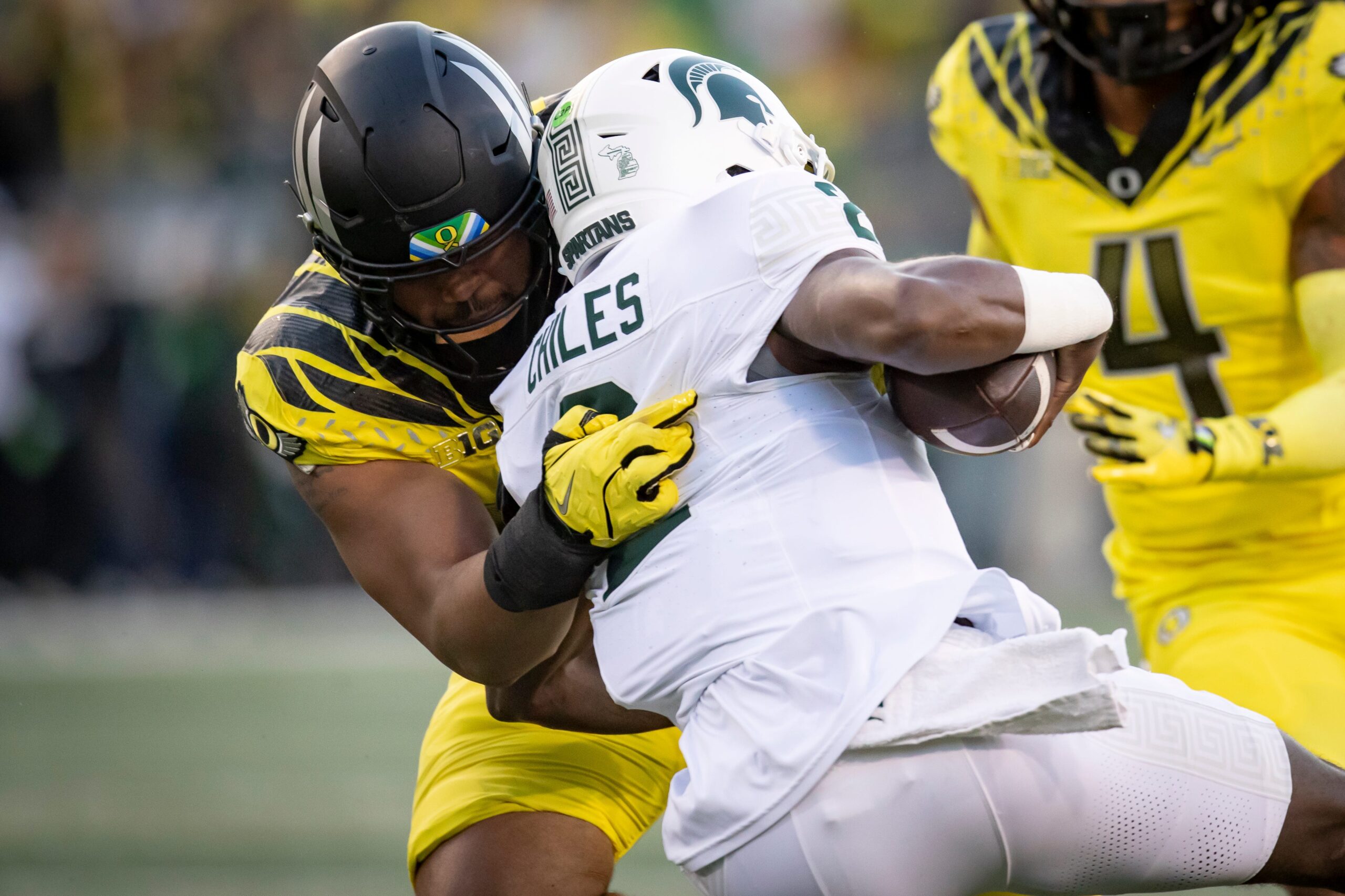 Oregon Ducks defensive lineman Derrick Harmon sacks Michigan State Spartans quarterback Aidan Chiles as the Ducks host the Spartans Friday, Oct. 4, 2024 at Autzen Stadium in Eugene, Ore.