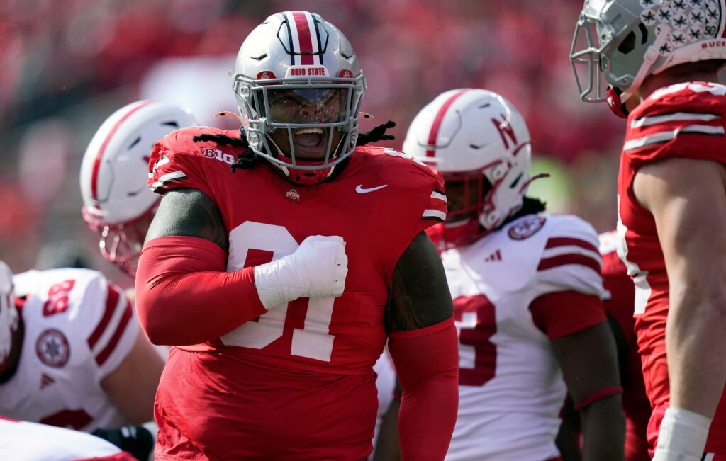 Ohio State Buckeyes defensive tackle Tyleik Williams celebrates the tackle of Nebraska Cornhuskers quarterback Dylan Raiola at Ohio Stadium