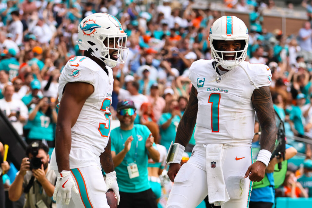 Miami Dolphins running back Raheem Mostert celebrates with quarterback Tua Tagovailoa after scoring a touchdown against the Arizona Cardinals at Hard Rock Stadium.