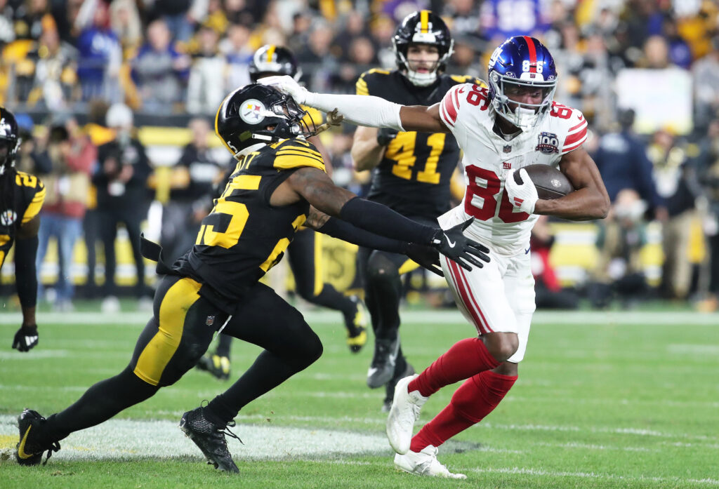 New York Giants wide receiver Darius Slayton runs after a catch as Pittsburgh Steelers safety DeShon Elliott defends during the second quarter at Acrisure Stadium