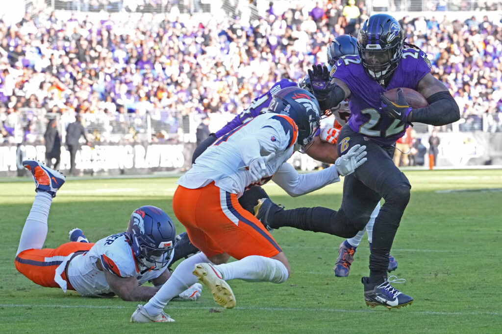 Baltimore Ravens running back Derrick Henry (22) scores a third quarter touchdown against the Denver Broncos at M&T Bank Stadium.