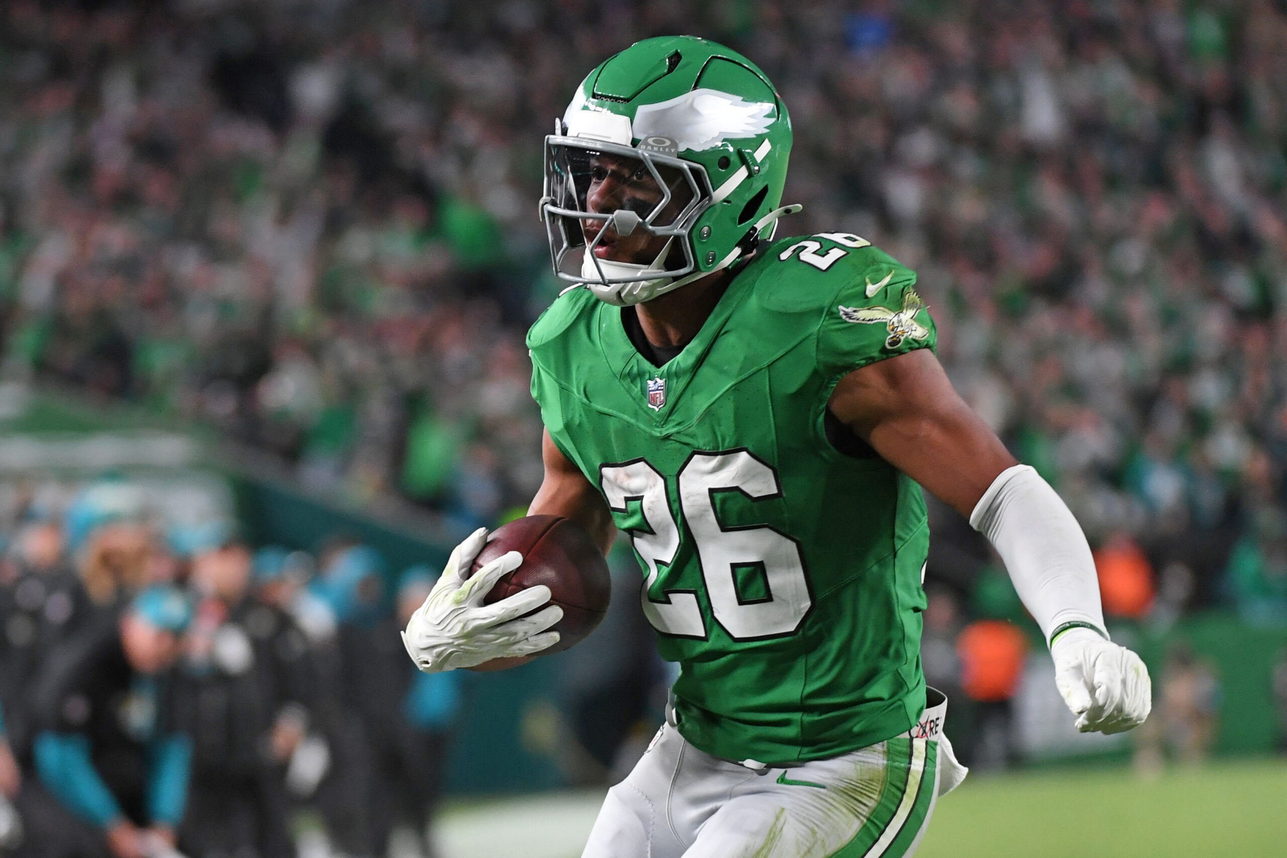 Philadelphia Eagles running back Saquon Barkley (26) score on a 19-yard touchdown run during the second quarter against the Jacksonville Jaguars at Lincoln Financial Field.