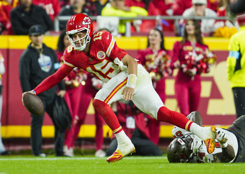 Kansas City Chiefs quarterback Patrick Mahomes scrambles from Tampa Bay Buccaneers linebacker Lavonte David during the second half at GEHA Field at Arrowhead Stadium.