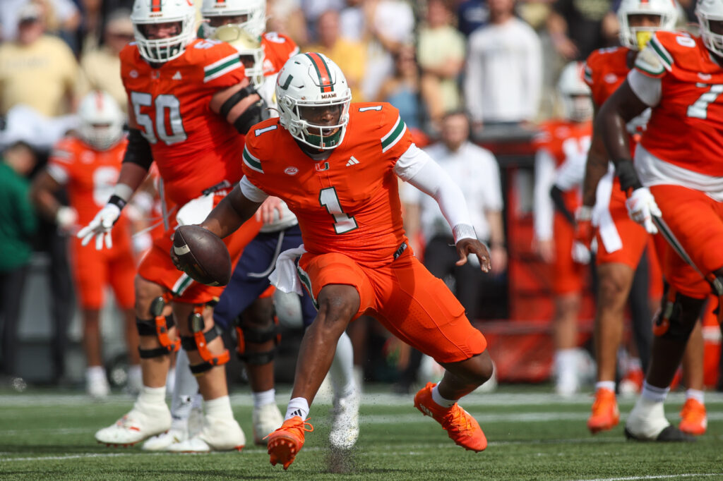 Miami Hurricanes quarterback Cam Ward (1) scrambles against the Georgia Tech Yellow Jackets in the second quarter at Bobby Dodd Stadium at Hyundai Field.