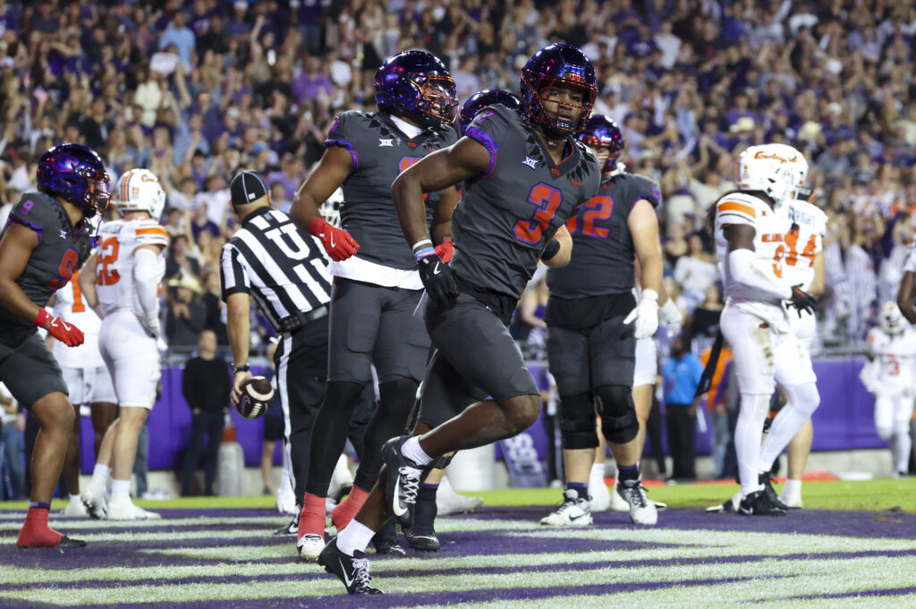 TCU Horned Frogs wide receiver Savion Williams (3) celebrates after scoring a touchdown during the second quarter against the Oklahoma State Cowboys at Amon G. Carter Stadium. 