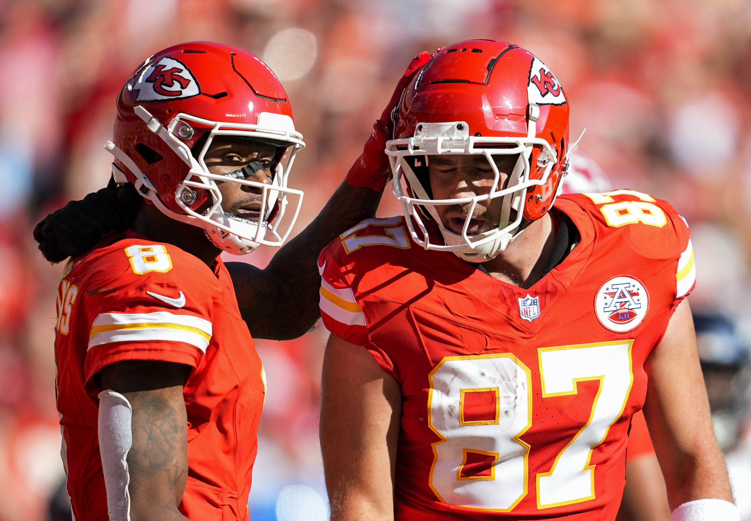 Kansas City Chiefs tight end Travis Kelce is congratulated by wide receiver DeAndre Hopkins after scoring a touchdown during the first half against the Denver Broncos at GEHA Field.