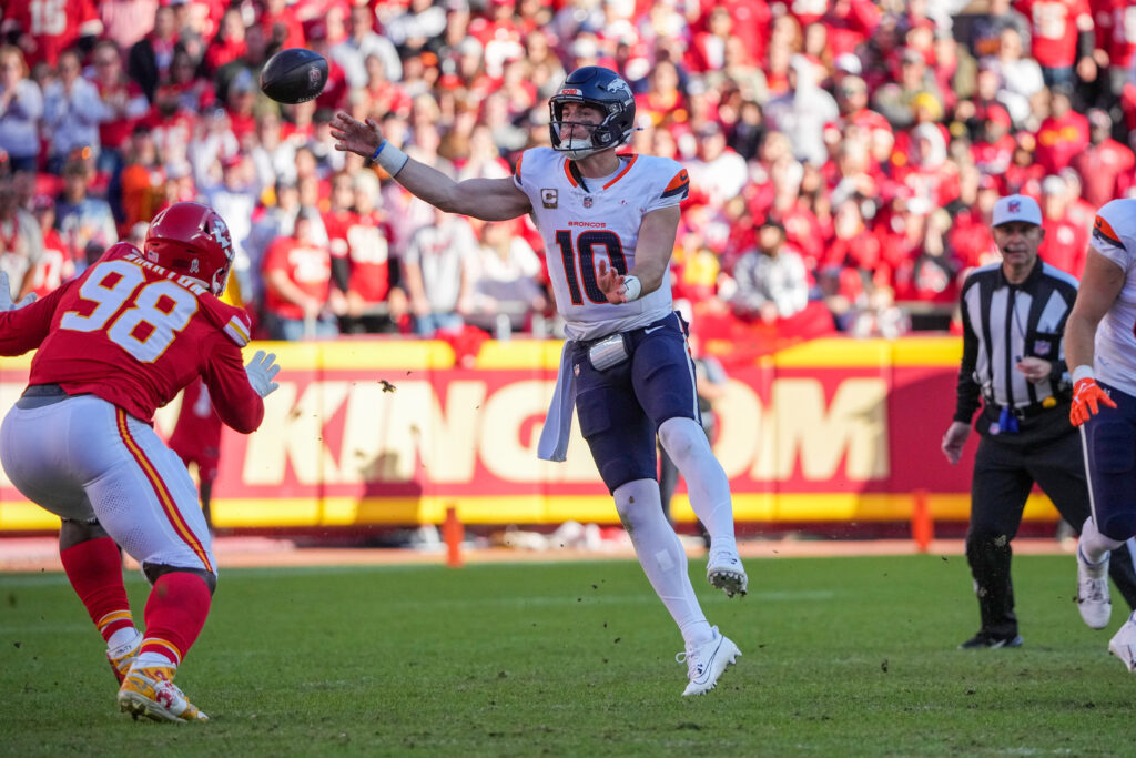 Denver Broncos quarterback Bo Nix throws a pass against the Kansas City Chiefs during the second half at GEHA Field at Arrowhead Stadium.