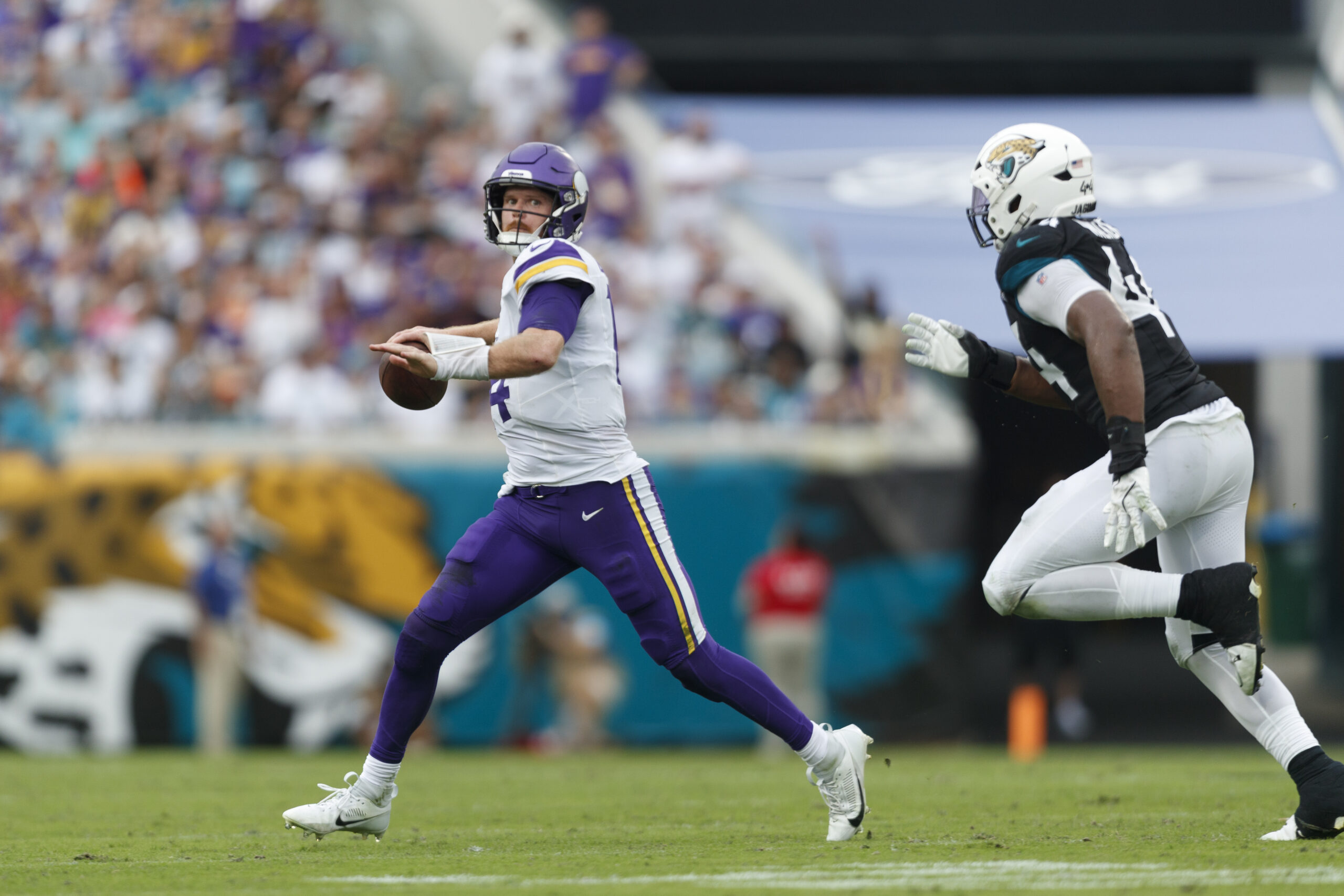 Minnesota Vikings quarterback Sam Darnold looks for a pass against the Jacksonville Jaguars during the fourth quarter at EverBank Stadium.