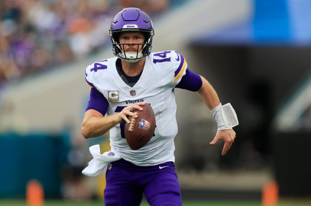 Minnesota Vikings quarterback Sam Darnold is pressured out of the pocket and forced to run during the second quarter at Everbank Stadium in Jacksonville, Fla. 