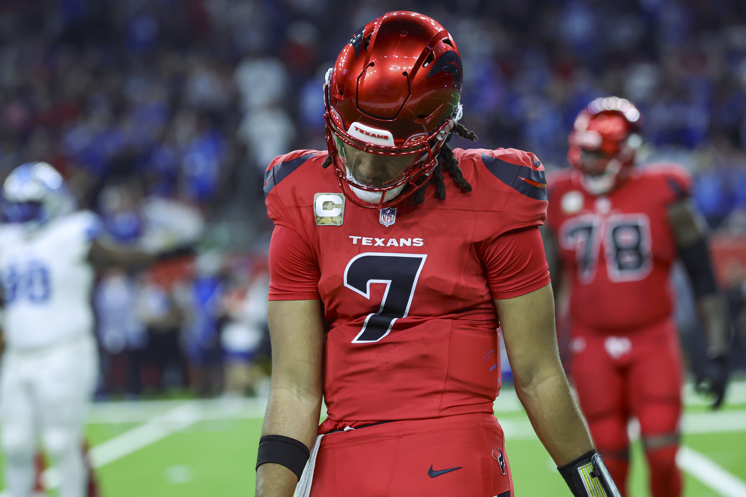 Houston Texans quarterback C.J. Stroud walks off the field after throwing an interception during the third quarter against the Detroit Lions at NRG Stadium.