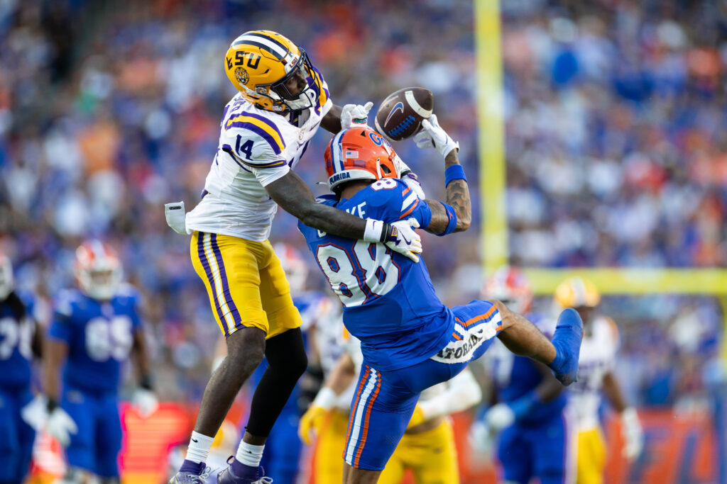 LSU Tigers cornerback Zy Alexander (14) breaks up a pass to Florida Gators wide receiver Marcus Burke (88) during the first half.