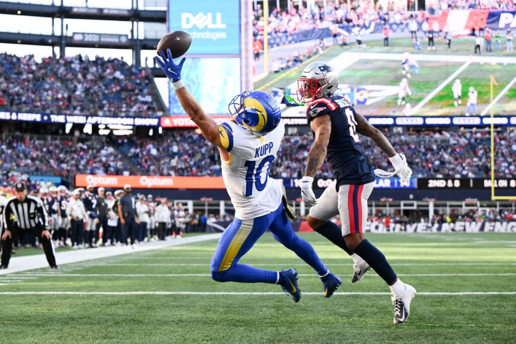 Los Angeles Rams wide receiver Cooper Kupp (10) is unable to complete a pass thrown by quarterback Matthew Stafford (not seen) during the first half of a game against the New England Patriots at Gillette Stadium.