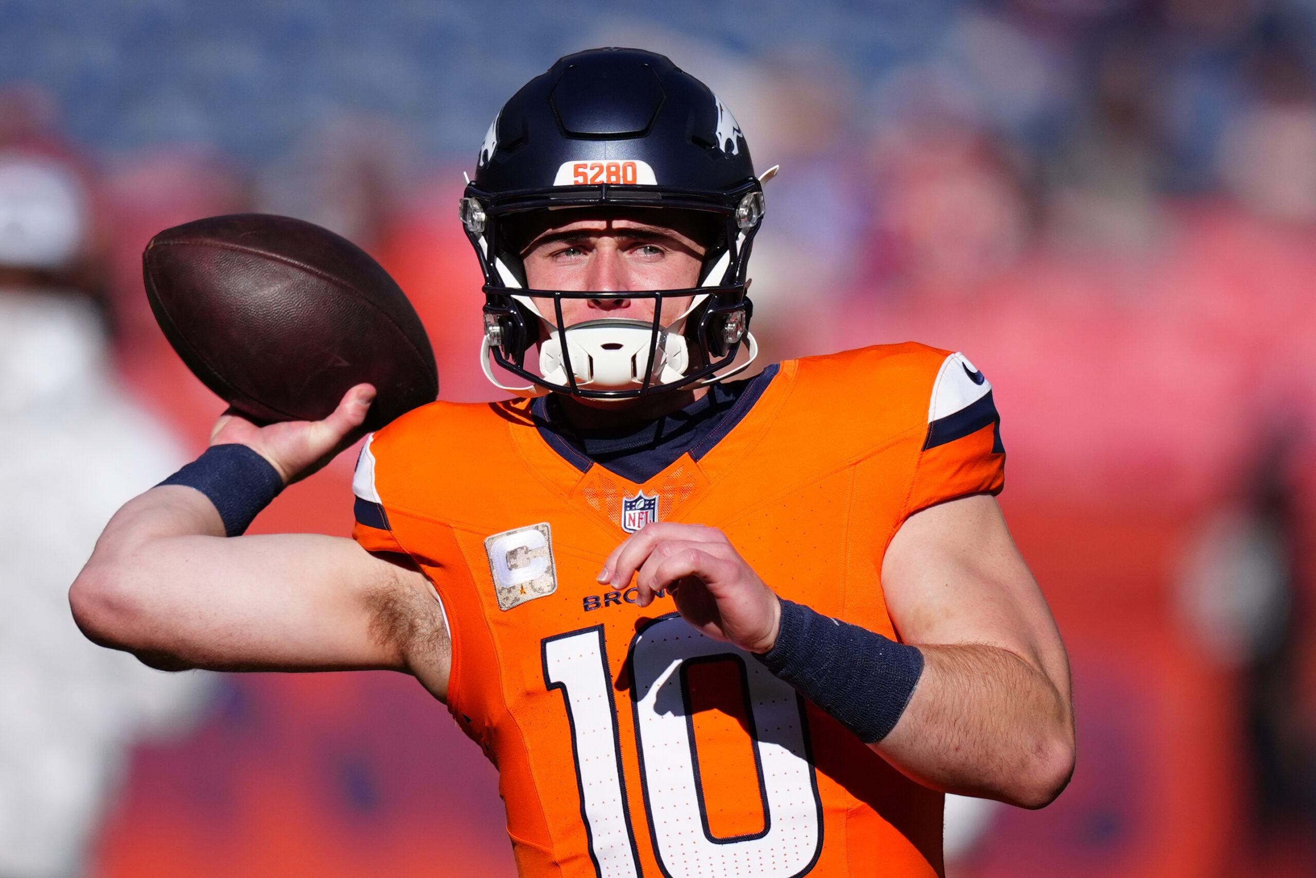 Denver Broncos quarterback Bo Nix (10) warms before the game against the Atlanta Falcons at Empower Field at Mile High.