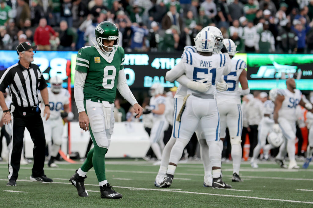 New York Jets quarterback Aaron Rodgers walks off the field after losing to the Indianapolis Colts at MetLife Stadium.