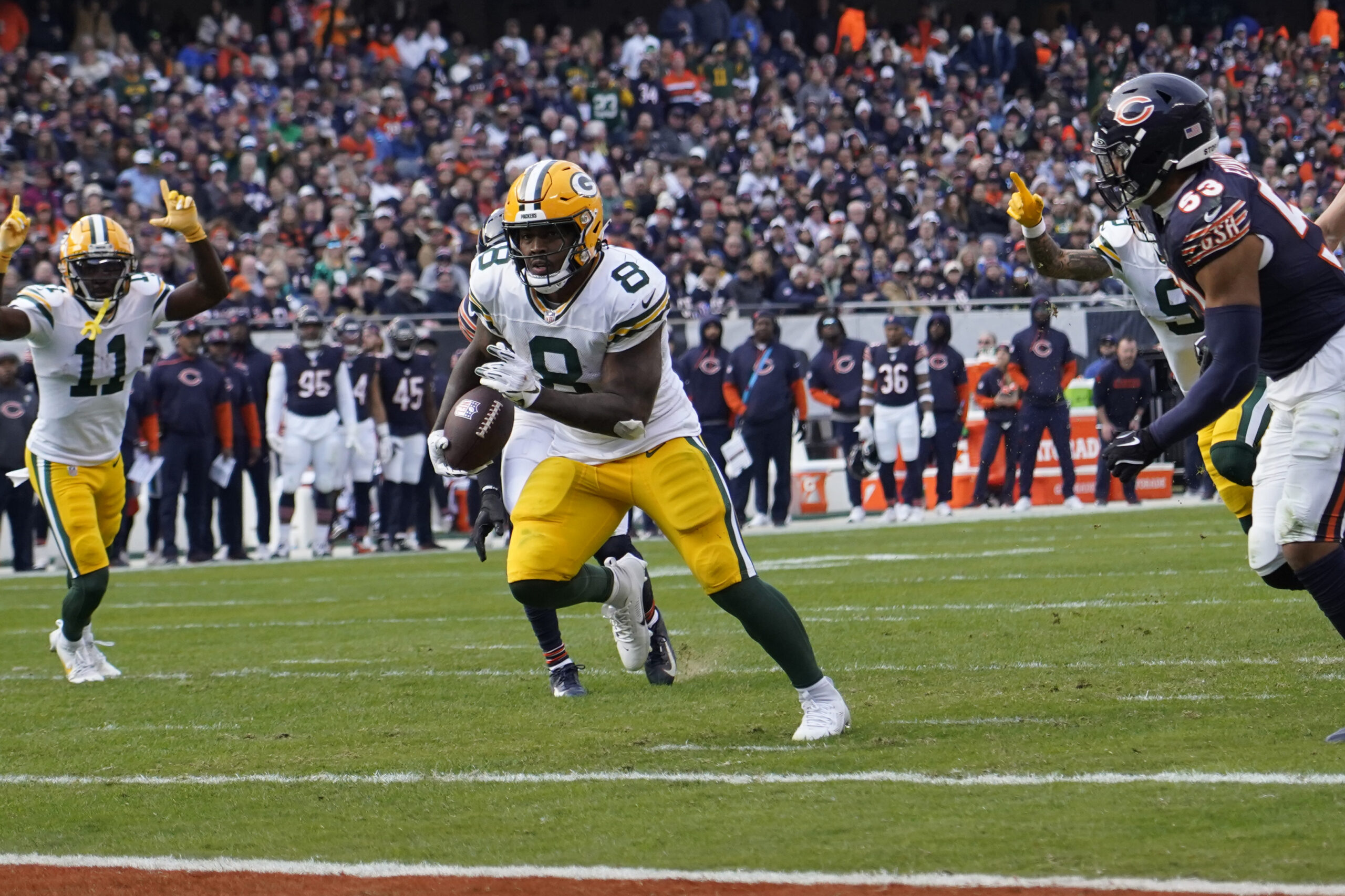 Green Bay Packers running back Josh Jacobs (8) runs for a touchdown against the Chicago Bears during the second half at Soldier Field.