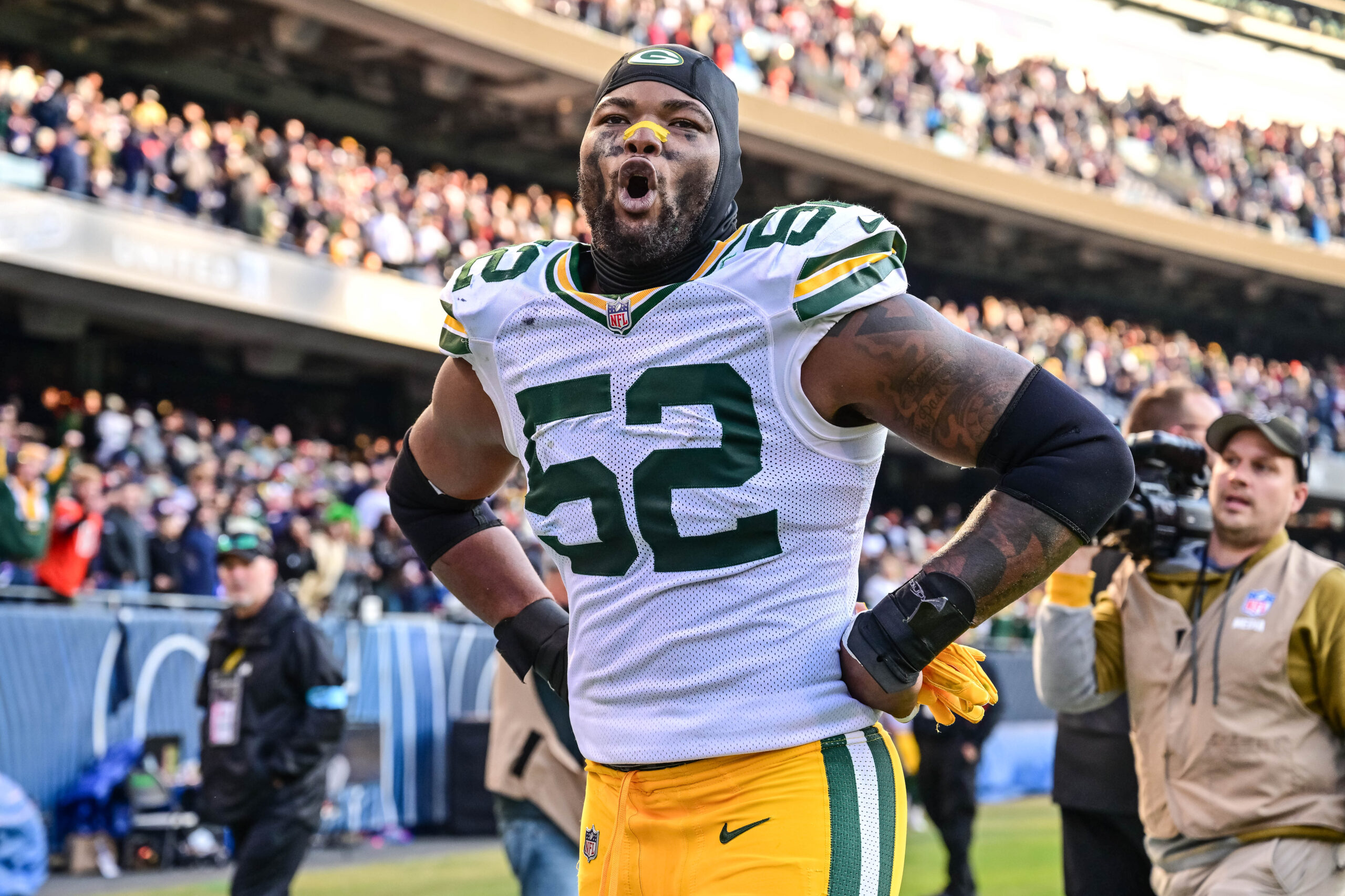 Green Bay Packers defensive end Rashan Gary (52) celebrates after the game against the Chicago Bears at Soldier Field.