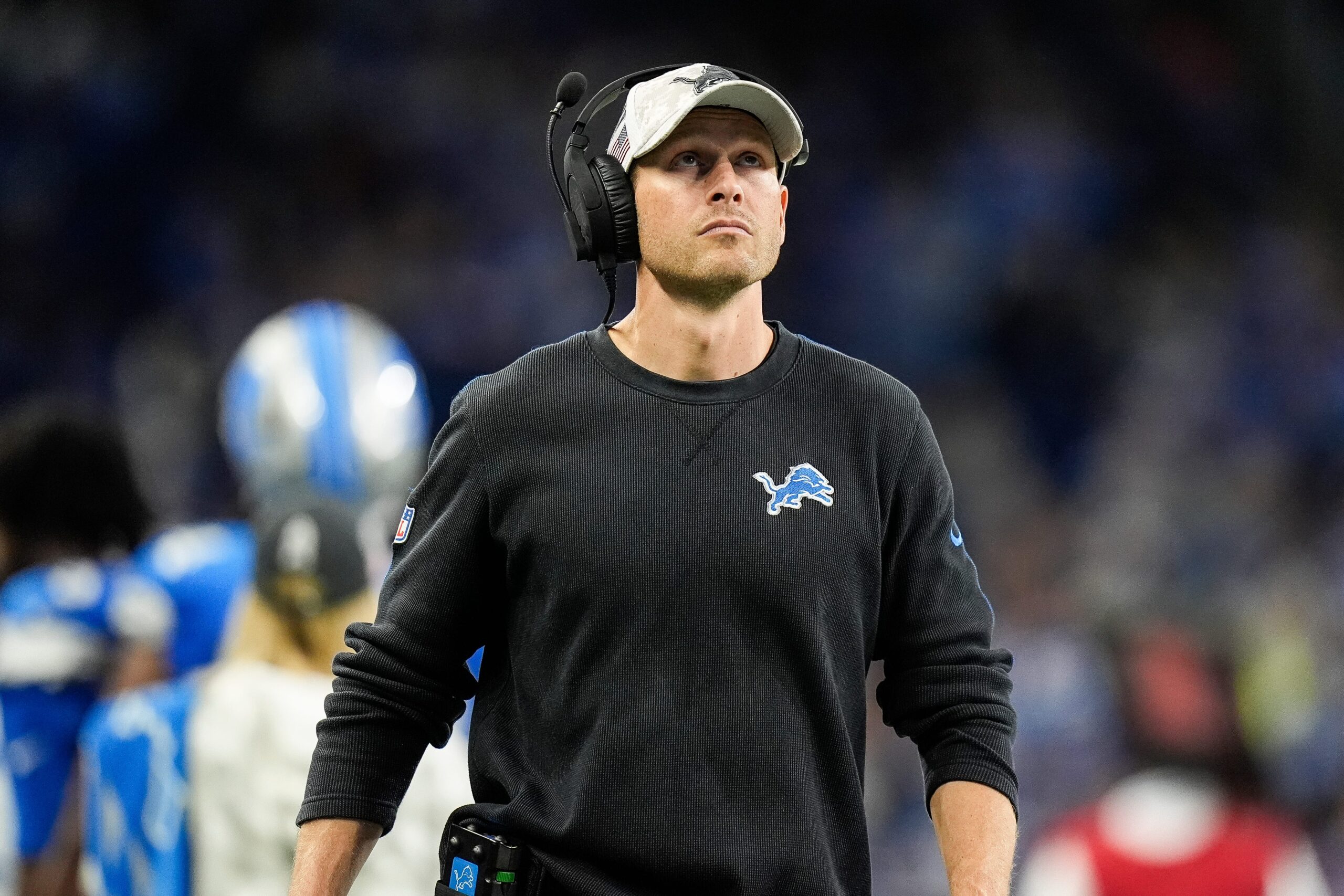 Detroit Lions offensive coordinator Ben Johnson watches a replay against Jacksonville Jaguars during the second half at Ford Field.