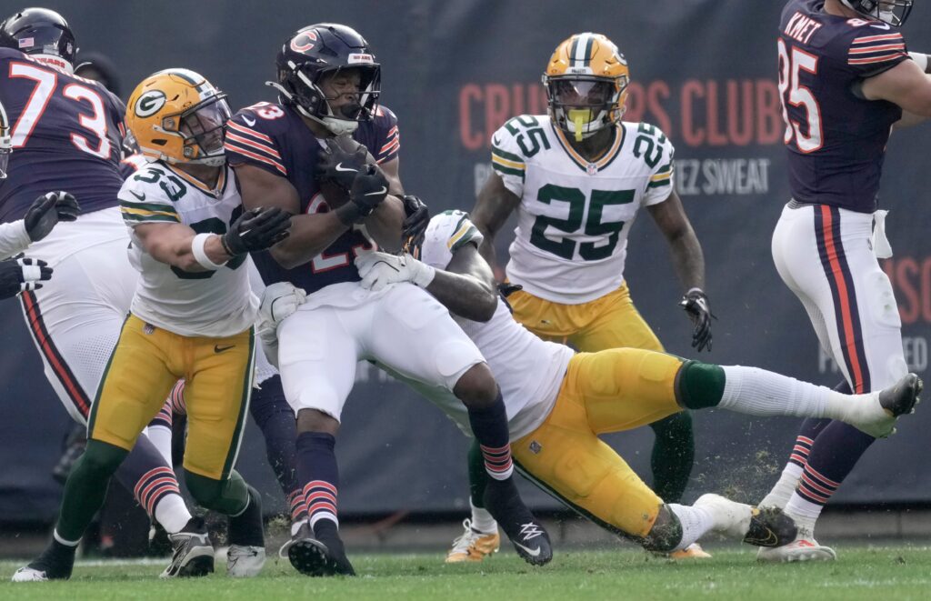 Green Bay Packers safety Evan Williams stops Chicago Bears running back Roschon Johnson short of the goal line during the second quarter of their game.