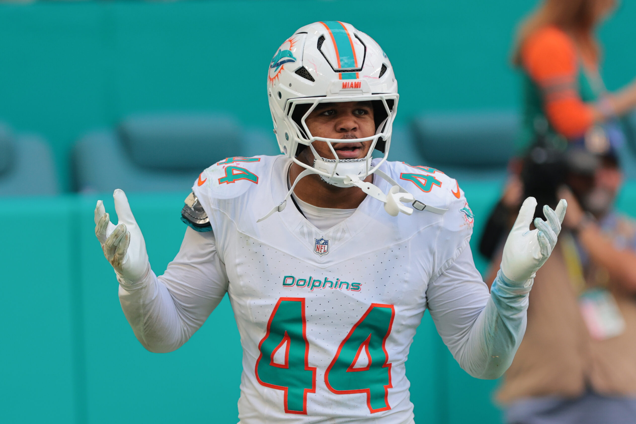 Miami Dolphins linebacker Chop Robinson (44) reacts after attempting to recover a fumble against the New England Patriots during the second quarter at Hard Rock Stadium.