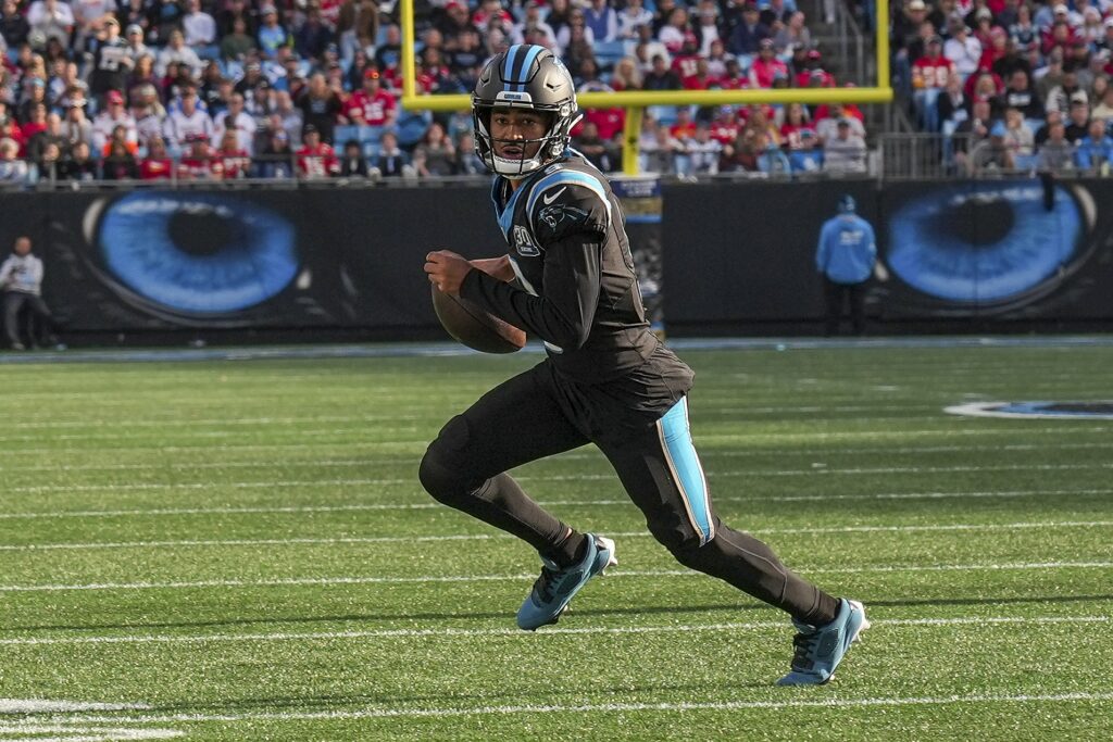 
Carolina Panthers quarterback Bryce Young (9) runs for yardage against the Kansas City Chiefs during the second half at Bank of America Stadium.