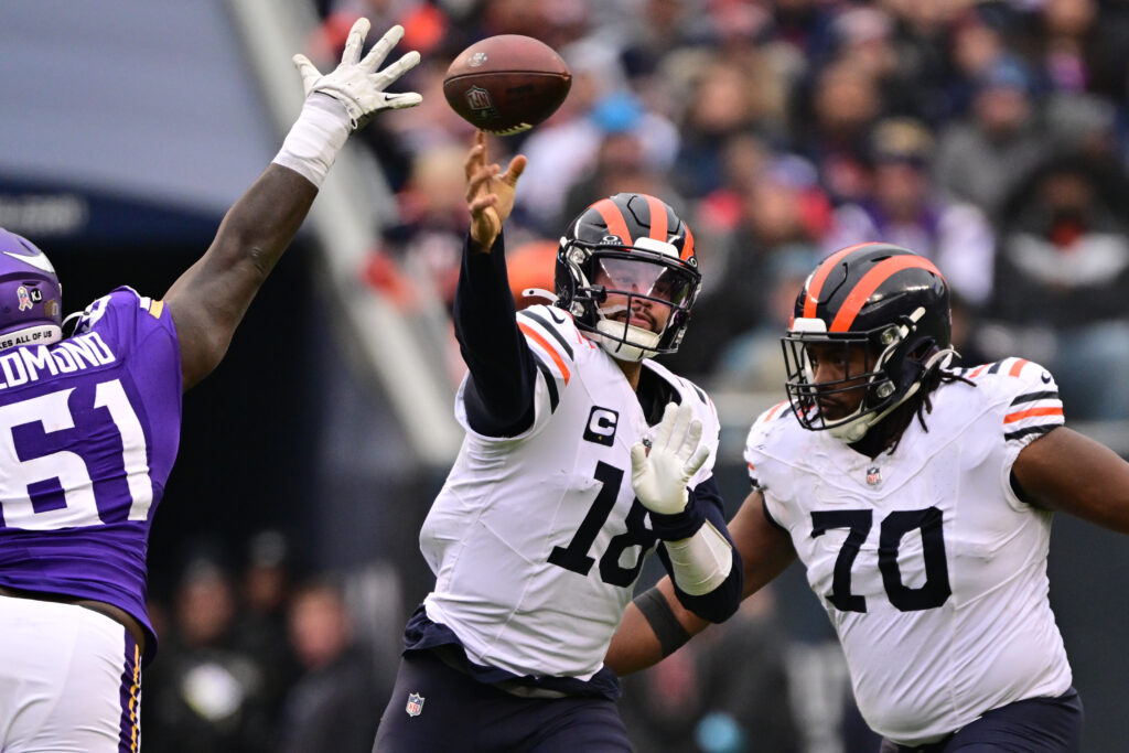 Chicago Bears quarterback Caleb Williams (18) passes the ball against the Minnesota Vikings during the third quarter at Soldier Field. 