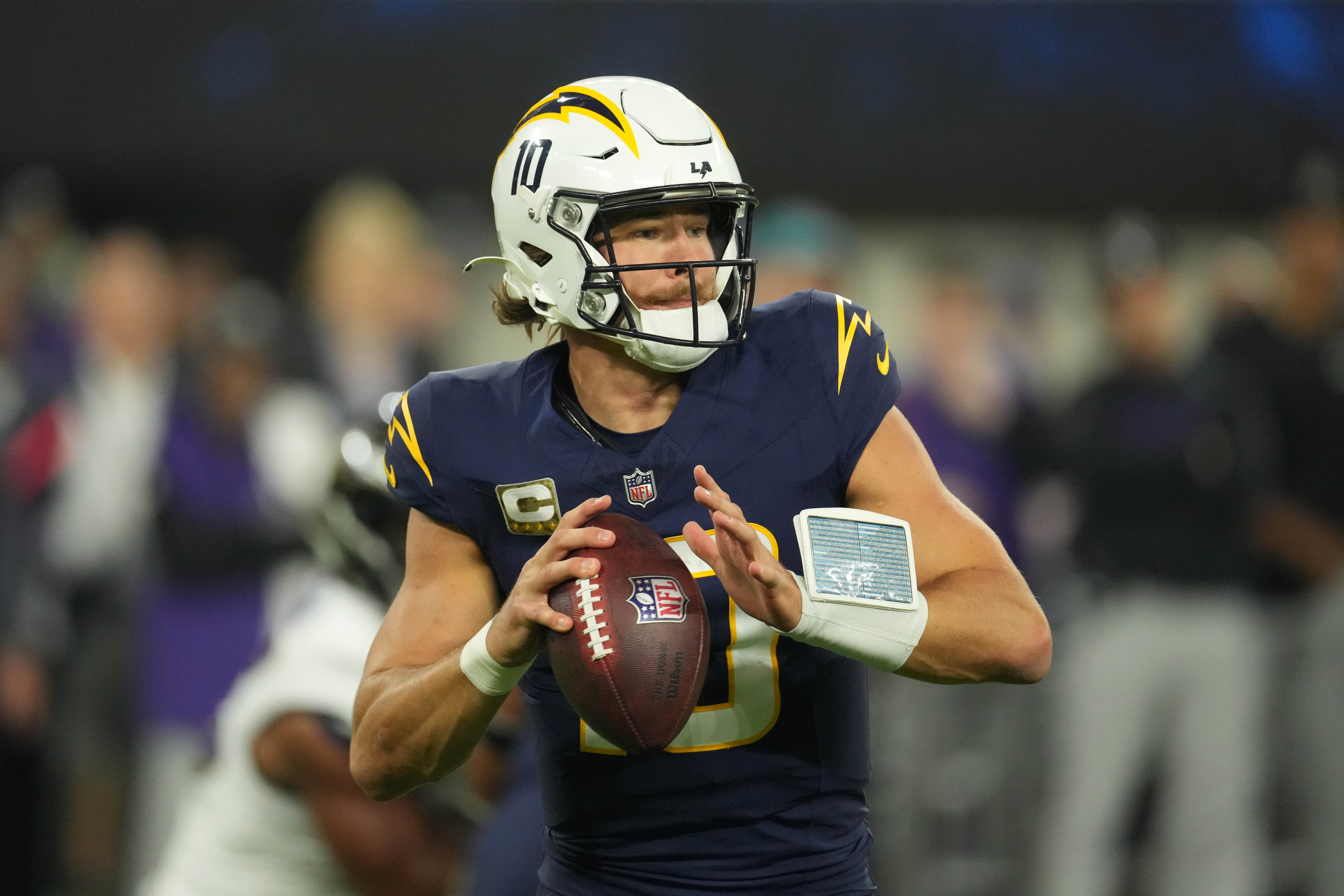 Los Angeles Chargers quarterback Justin Herbert (10) throws the ball against the Baltimore Ravens in the first half at SoFi Stadium.